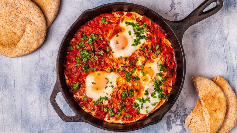 A cast-iron skillet containing shakshuka.