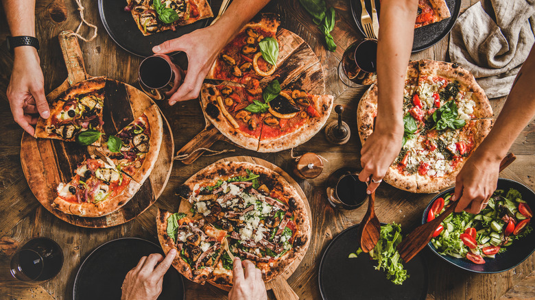 Pizzas with wine and salad