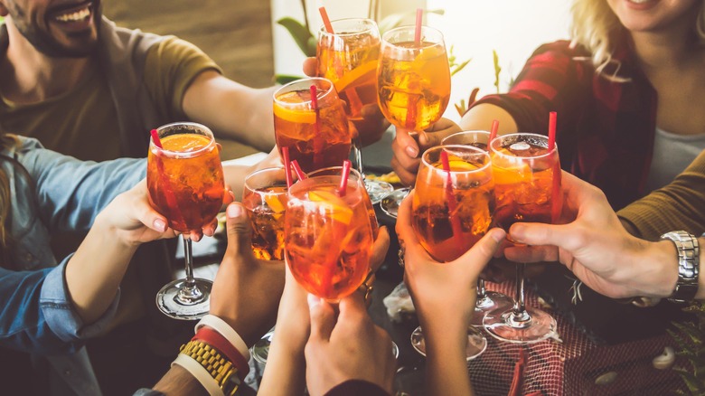 Friends toasting with cocktails