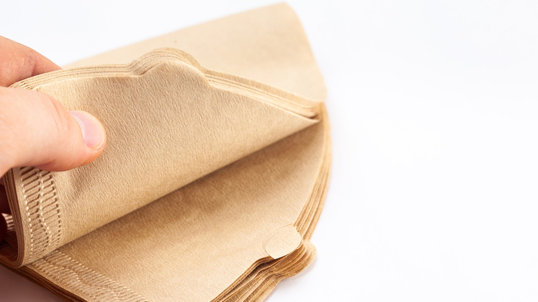 A stack of brown, unbleached coffee filters