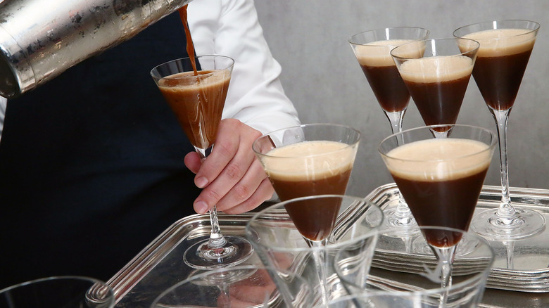 Bartender making a batch of espresso martinis.