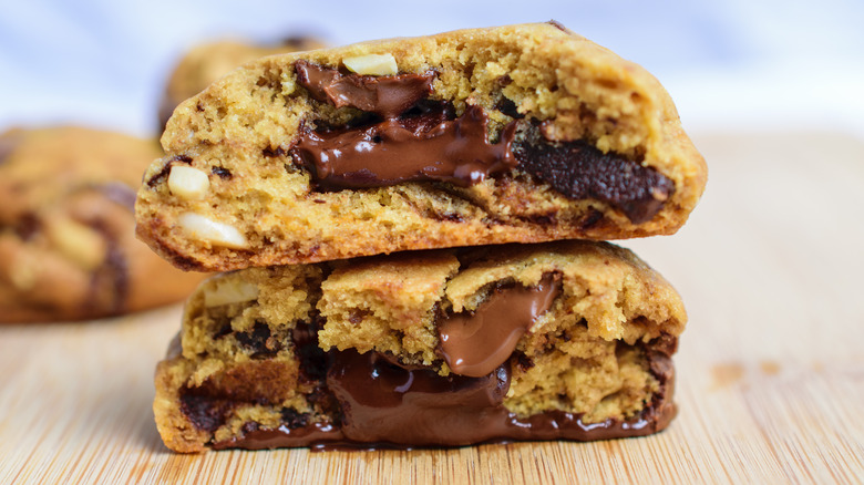 Two plump, stacked chocolate chip cookies