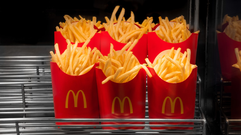 Six McDonald's fries boxes in a warmer