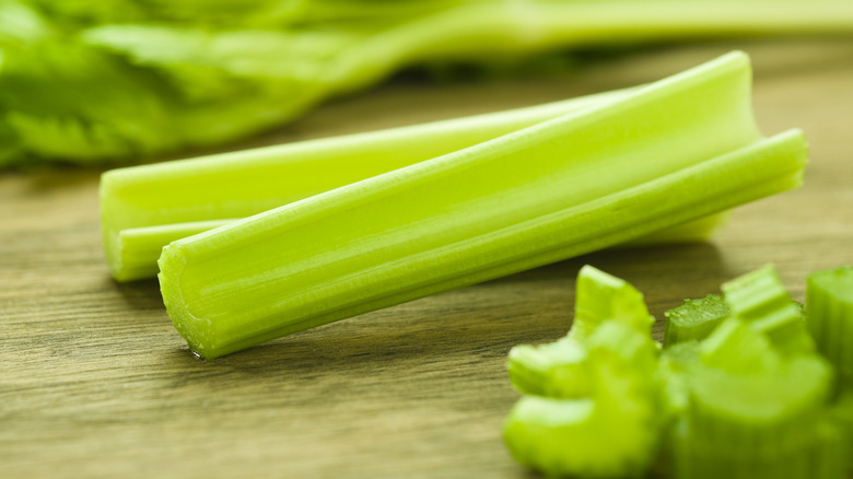 sliced celery on cutting board