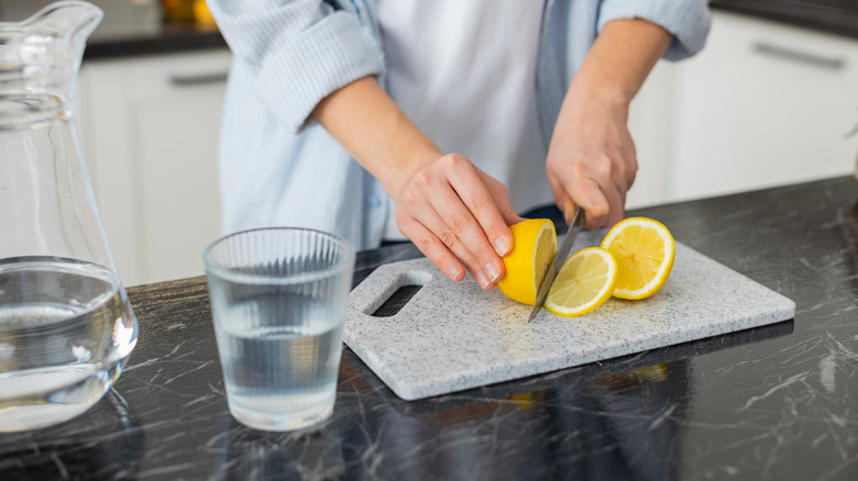 A person preparing food on a countertop.
