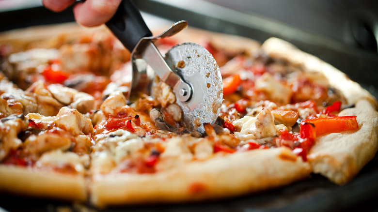 Pizza cutter in action