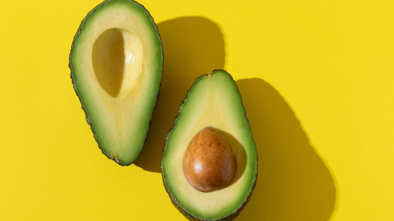 Two halves of an avocado