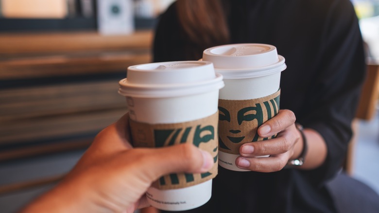 Friends sharing Starbucks coffee