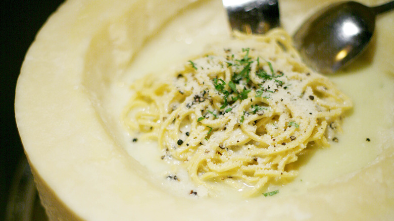 Cacio e pepe in cheese wheel