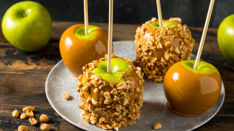 caramel apples coated in peanuts