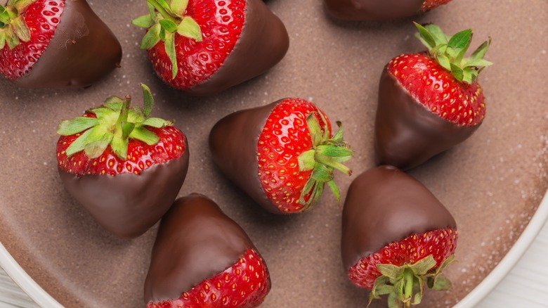 Chocolate-covered strawberries on plate