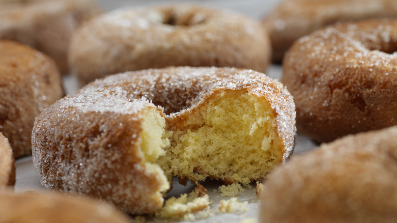 Sugar donut with bite missing