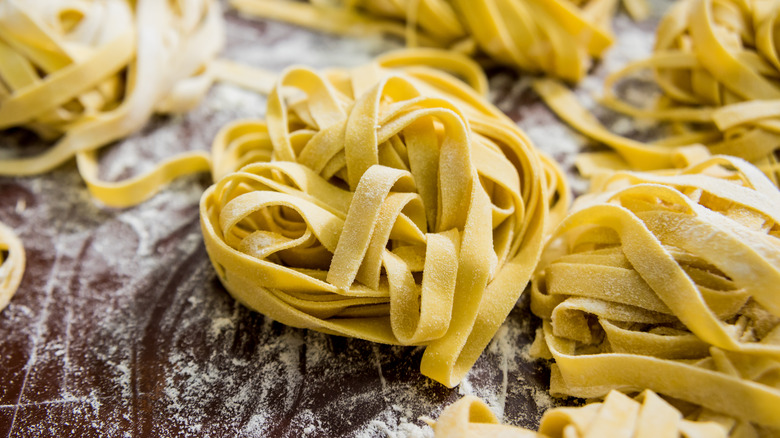 fresh pasta noodles in nests