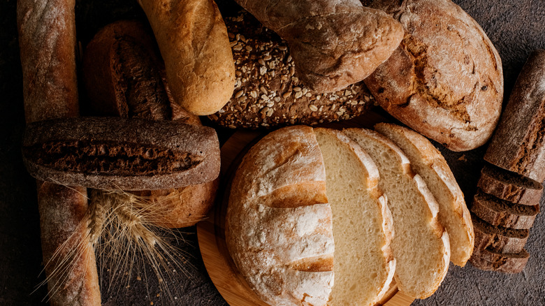 Loaves of freshly baked bread on wooden table