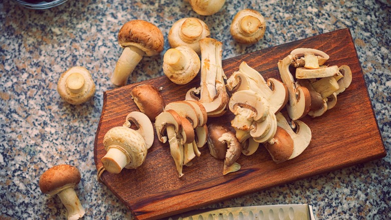 Pile of mushrooms, whole and sliced