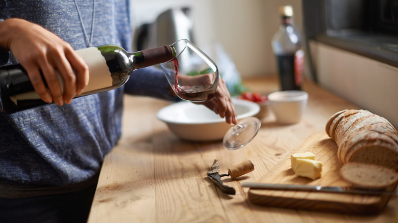 Woman pouring red wine