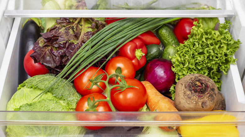 Tomatoes in crisper drawer with other produce