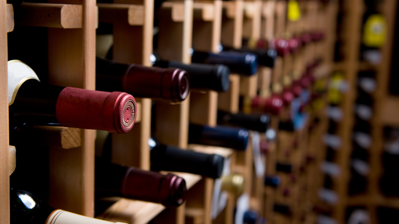 Rows of stored wine bottles