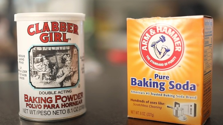 Containers of baking powder and baking soda