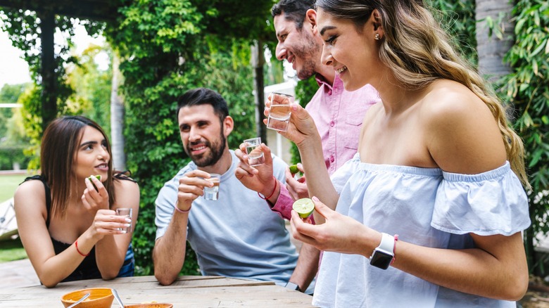 friends tasting tequila and mezcal