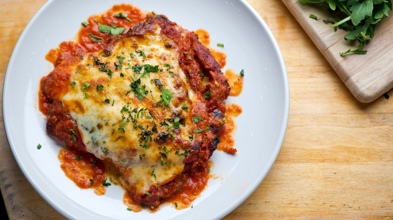 Chicken parmesan on white plate