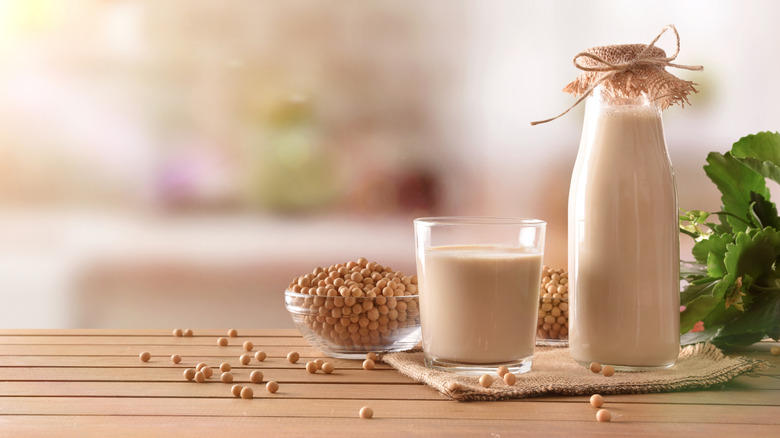A bottle and glass of soy milk