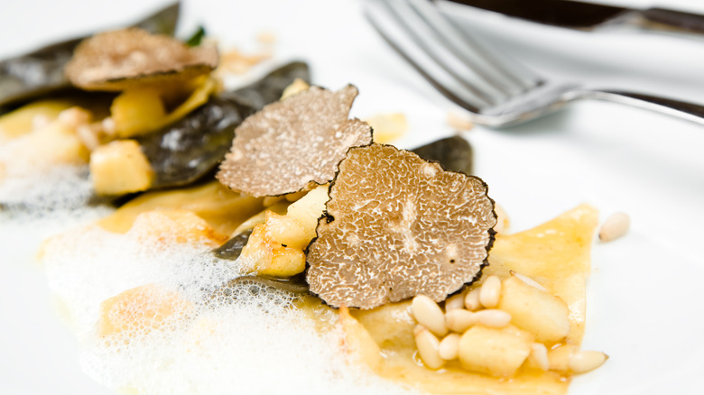 Sliced truffles on fancy restaurant dish