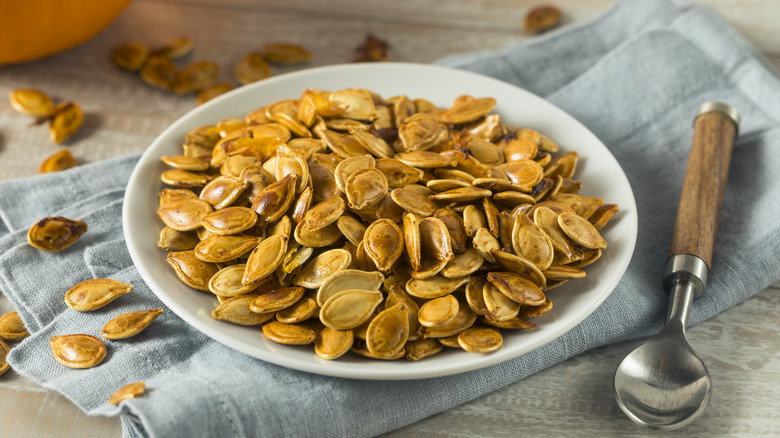 Roasted pumpkin seeds on plate