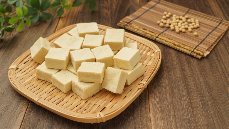 Cubes of tofu on a wooden board