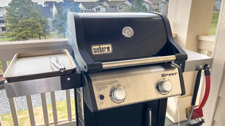 A Weber gas grill on a patio