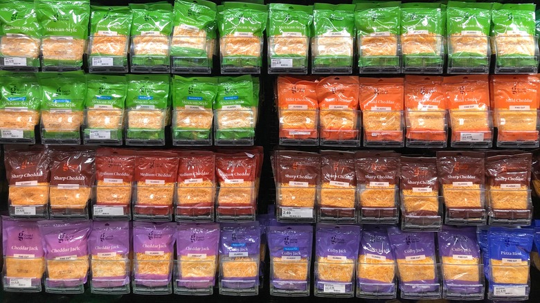 Bags of shredded cheese in grocery store
