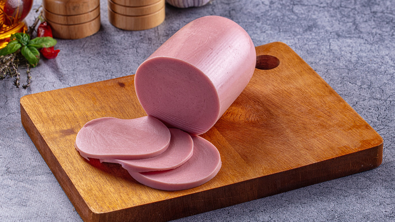 bologna sliced on cutting board
