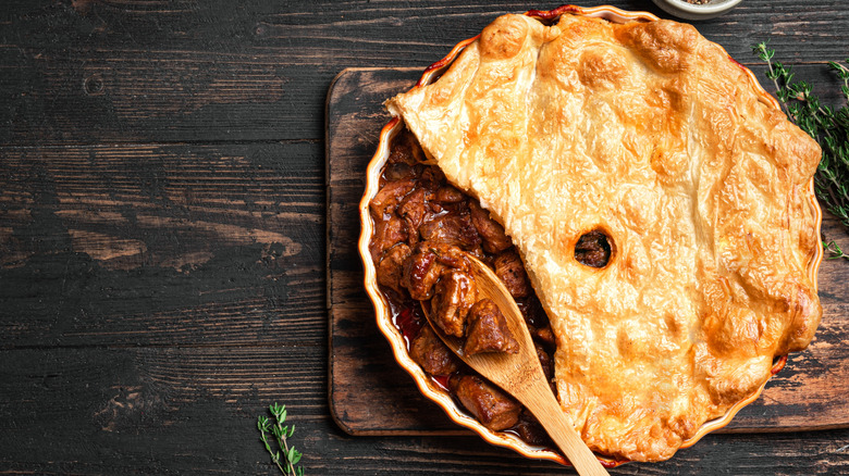 A beef pie with a dark beer sauce