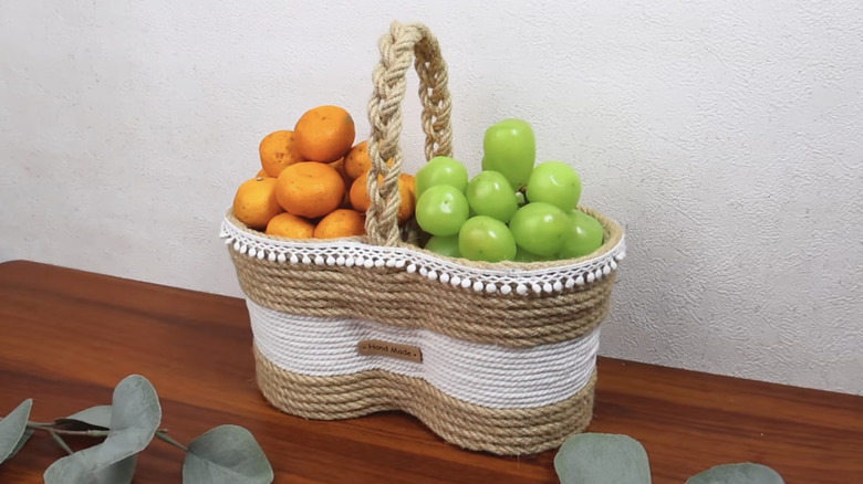 A fruit basket made from yogurt containers