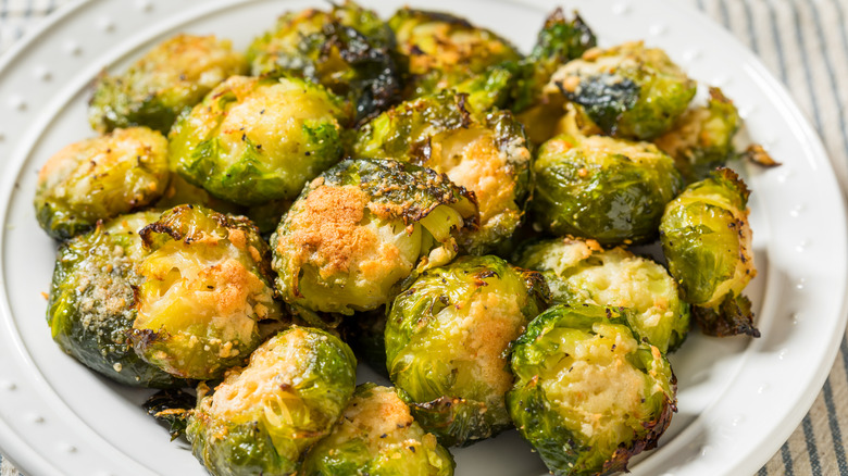Brussels sprouts served on a white plate