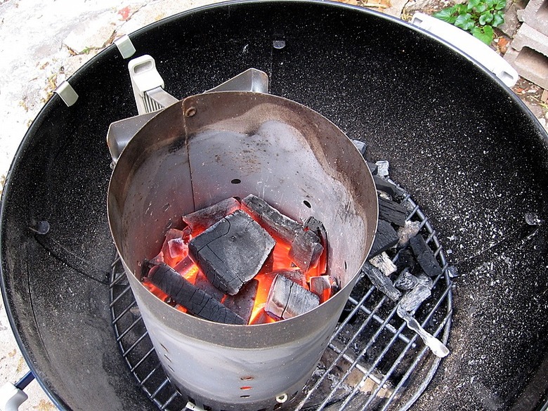 Charcoal briquettes in a chimney starter