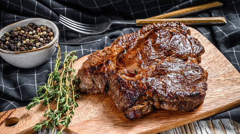 Cooked chuck roast on a wooden cutting board