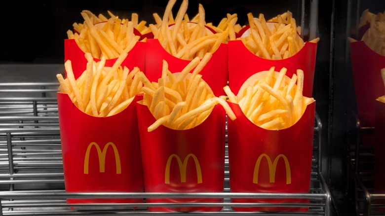 McDonald's fry containers on a heated tray