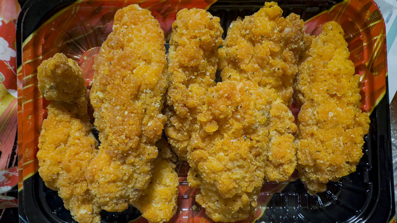 Chicken tenders laid out on a decorative plate