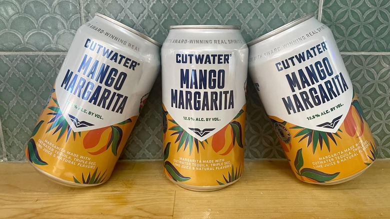 Three cans of Cutwater Mango Margarita cocktails