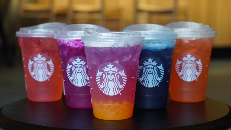 Starbucks' Strawberry Açaí Lemonade Refresher, Mango Dragonfruit Lemonade Refresher, Tropical Butterfly Lemonade Refresher, Blue Coconut Lemonade Refresher, and Mango Strawberry Lemonade Refresher (left to right).