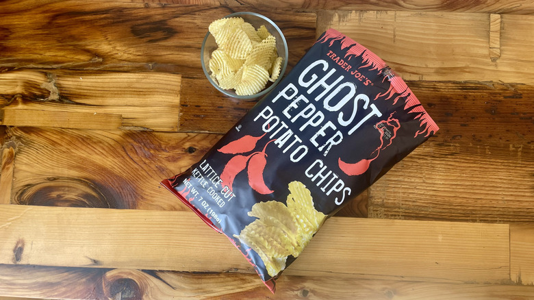Overhead view of Ghost Pepper Potato Chips on a wooden table top