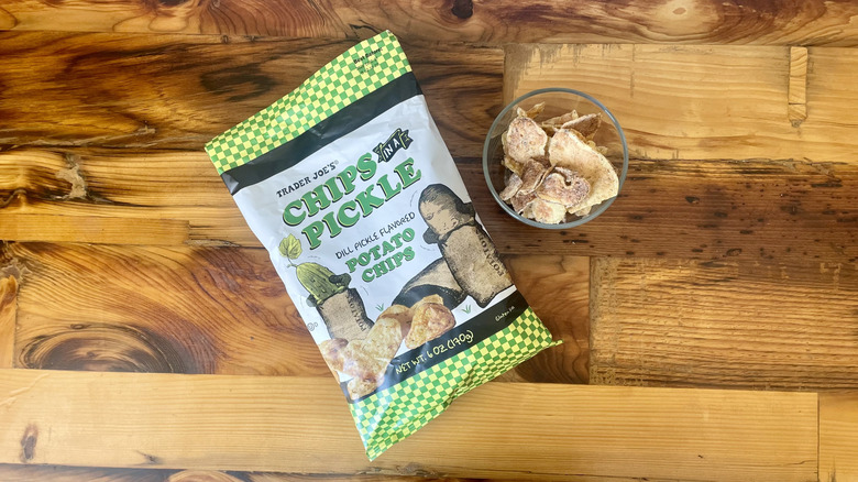 Overhead view of a bag of Chips In A Pickle on a wooden table top