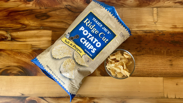 Overhead view of Ridge Cut Salt & Pepper Potato Chips on a wooden table top