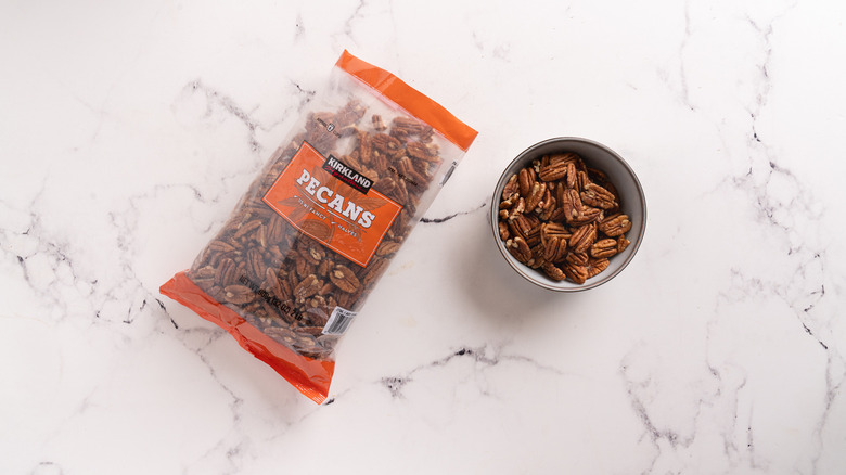 bag and a bowl of pecans