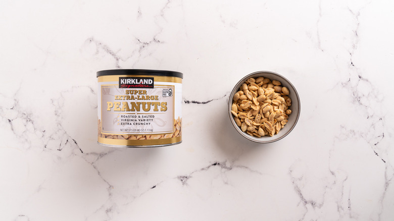 container and a bowl of peanuts