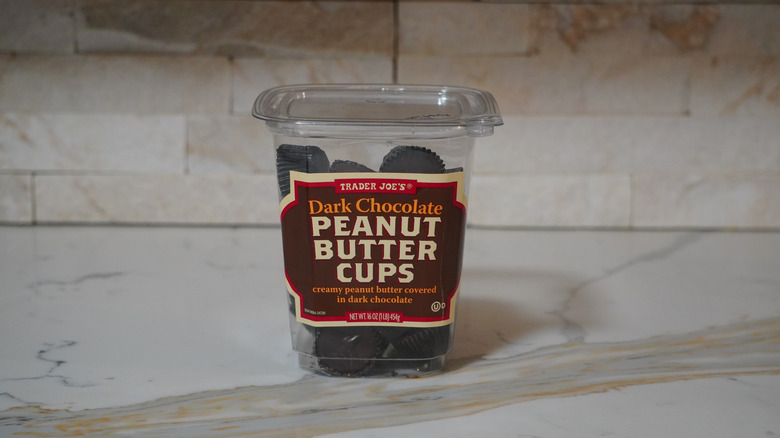 Package of Trader Joe's Dark Chocolate Peanut Butter Cups on marble countertop