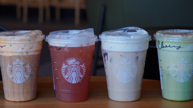 Starbucks' Iced Pumpkin Cream Shaken Espresso, Iced Chaider, Iced Banana Bread Chai, and Iced Pumpkin Cream Matcha (left to right).