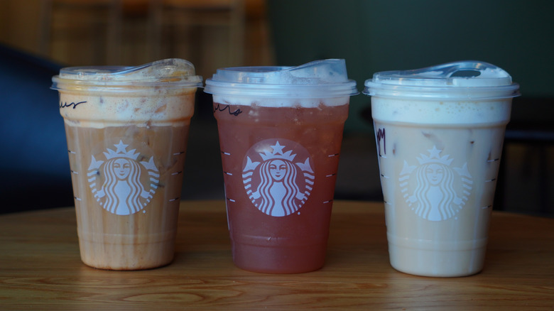 Starbucks' Iced Pumpkin Cream Shaken Espresso, Iced Chaider, and Iced Banana Bread Chai (left to right).