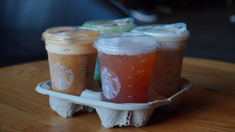 Starbucks drinks in a disposable drink holder.